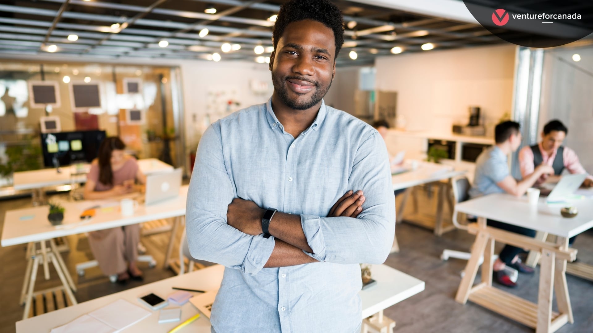 Solopreneur standing in a shared workspace